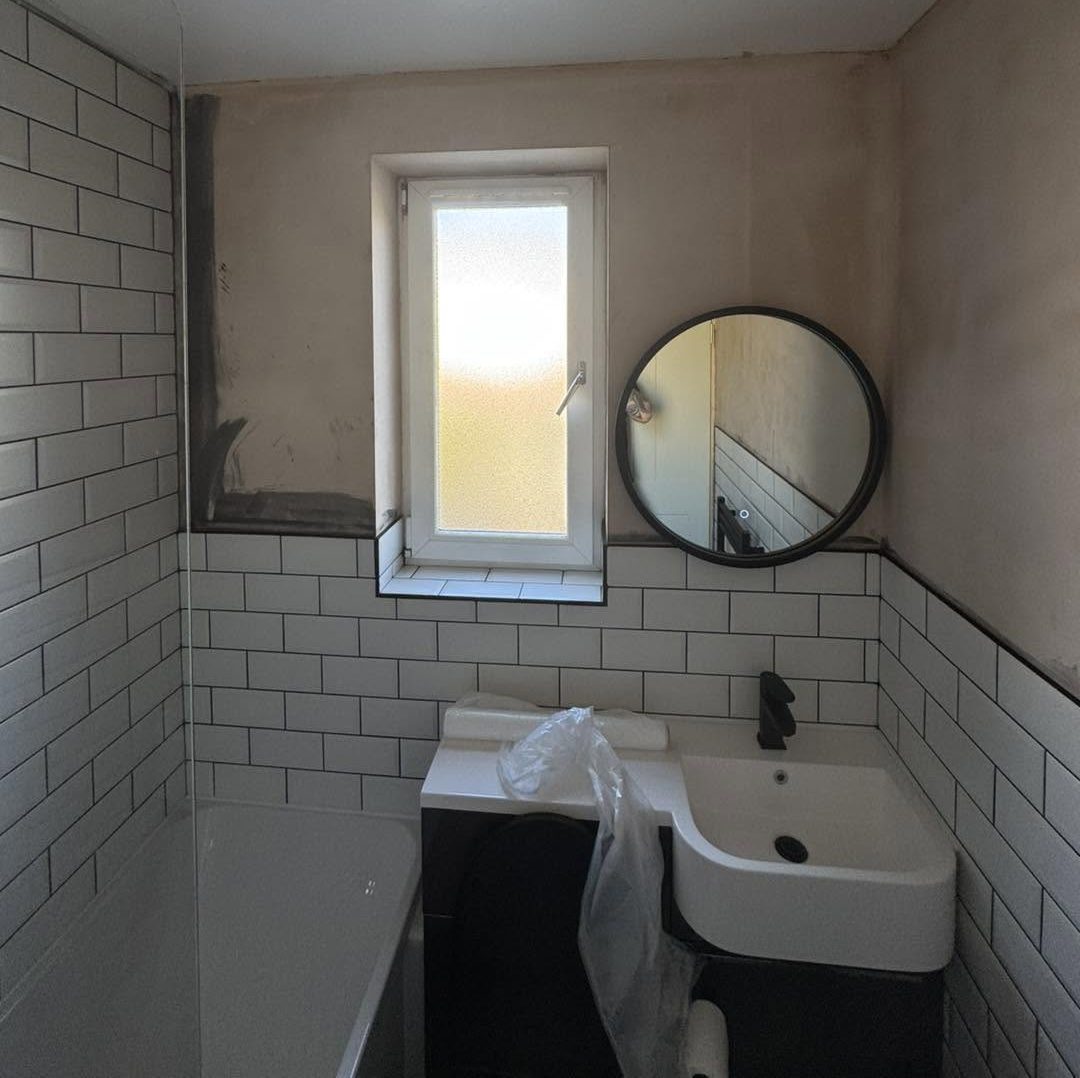 Before image of hand-painted bathroom transformation